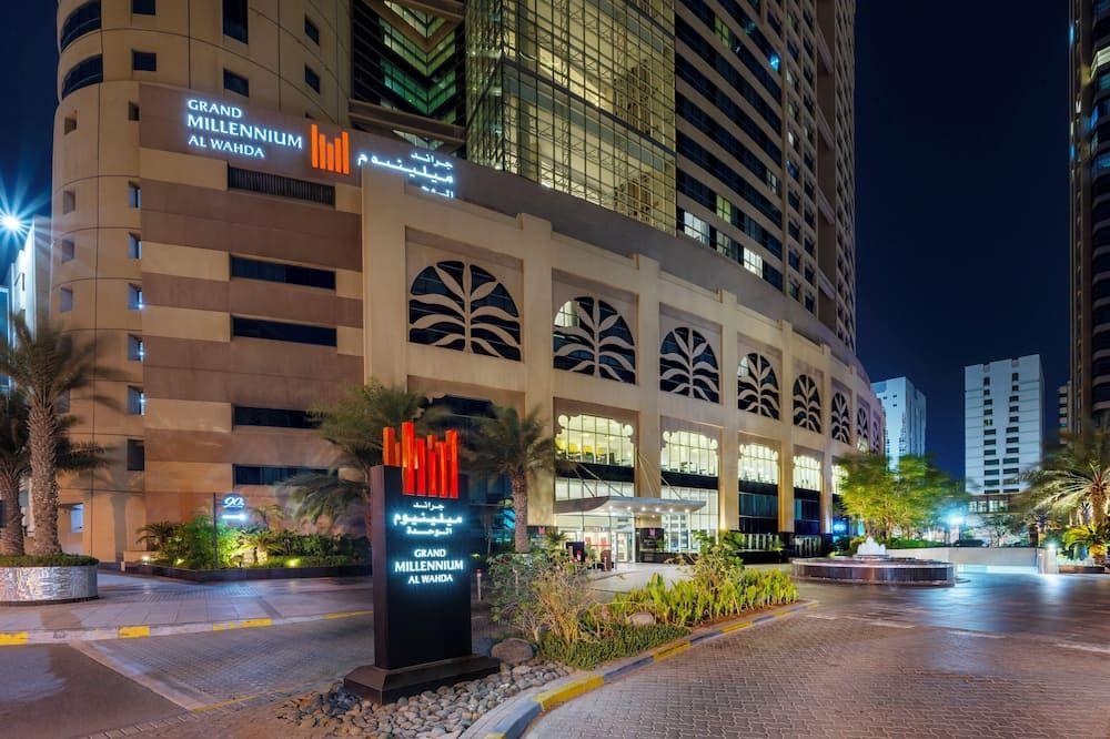 Grand Millennium Al Wahda rising above the Al Wahda Complex on Hazza Bin Zayed Street