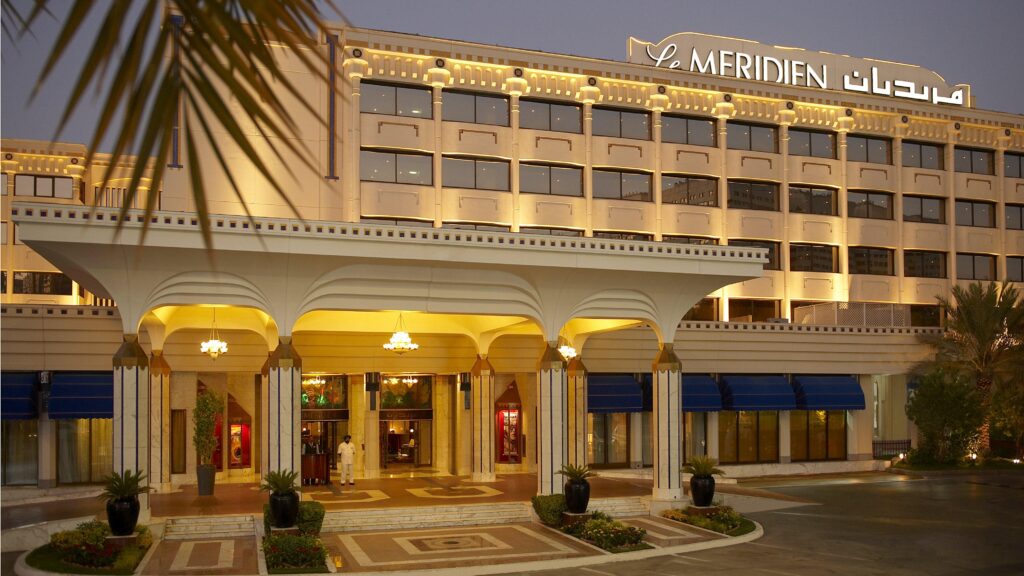 The low rise buildings of Le Meridien Abu Dhabi Resort among mature gardens