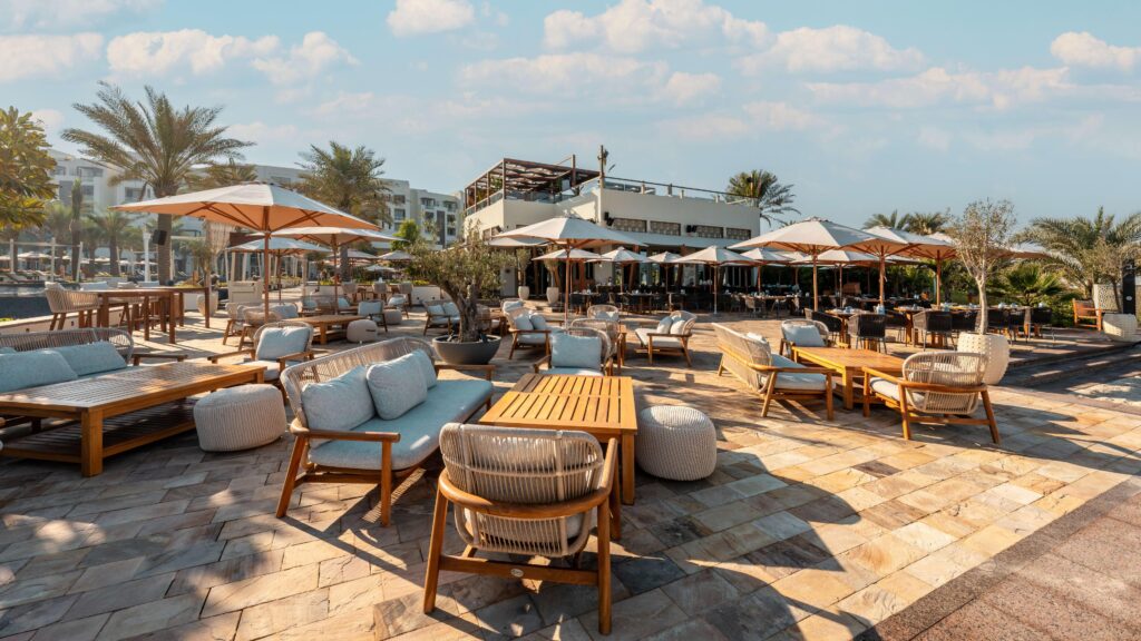 The Beach House restaurant with its doors open onto the sand