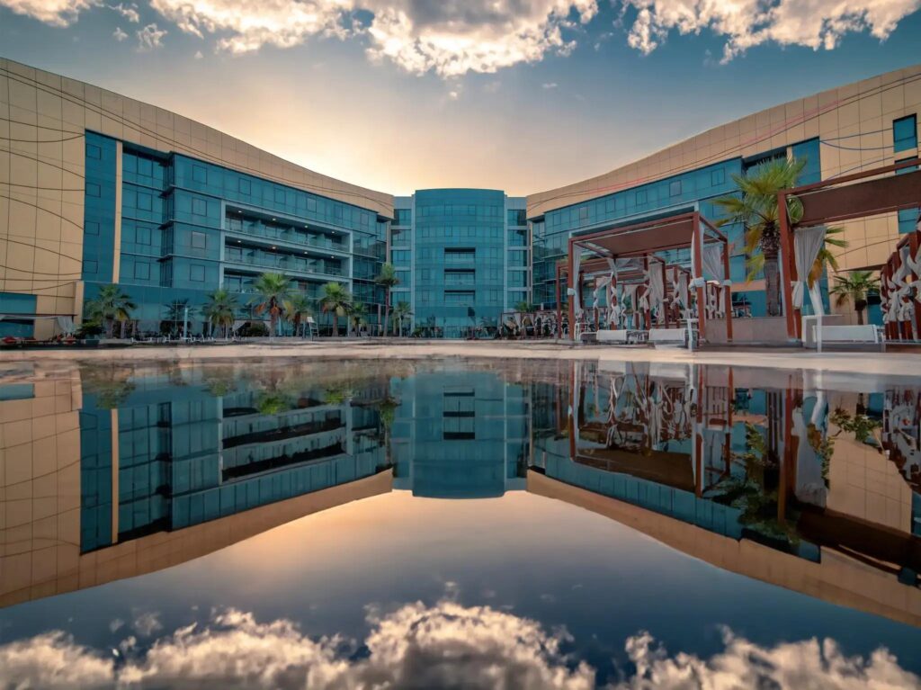 The streamlined nautical exterior of Royal M Hotel by Gewan on Al Bateen Marina