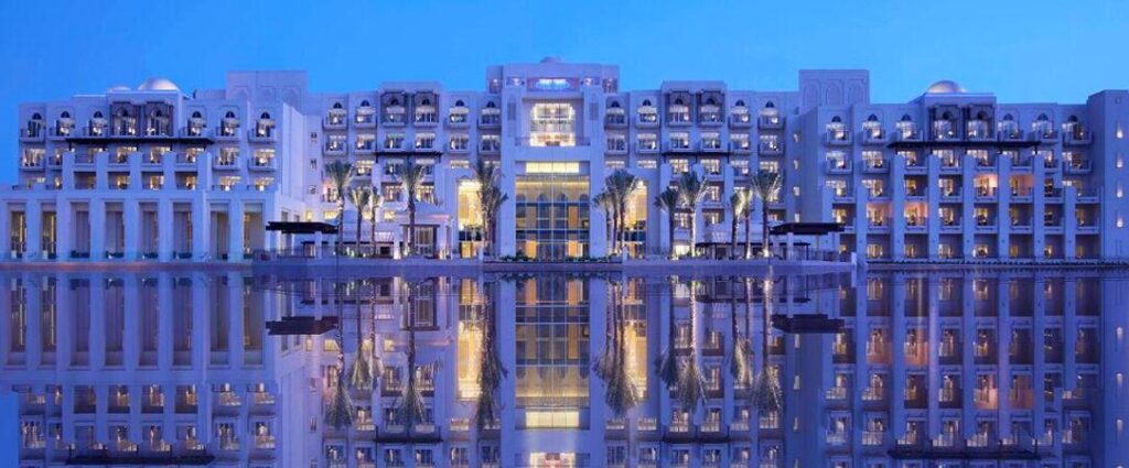 The hotel seen across the mangrove channel at dusk