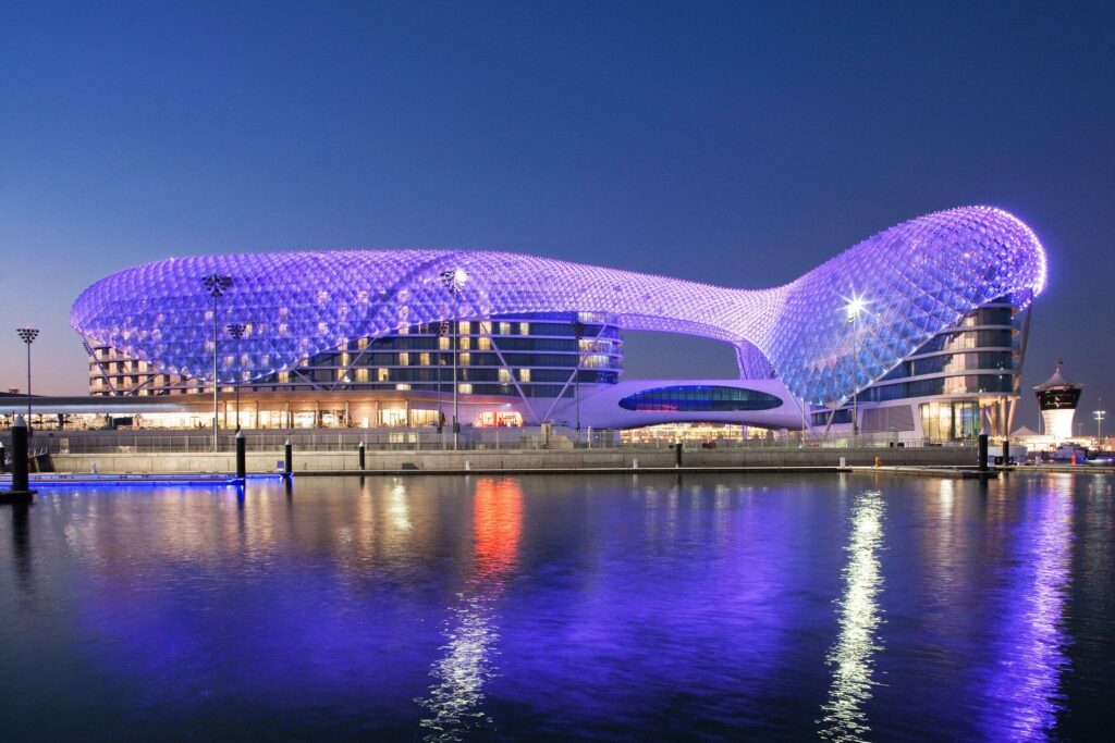 The illuminated Grid Shell arching over the Yas Marina Circuit between the two towers