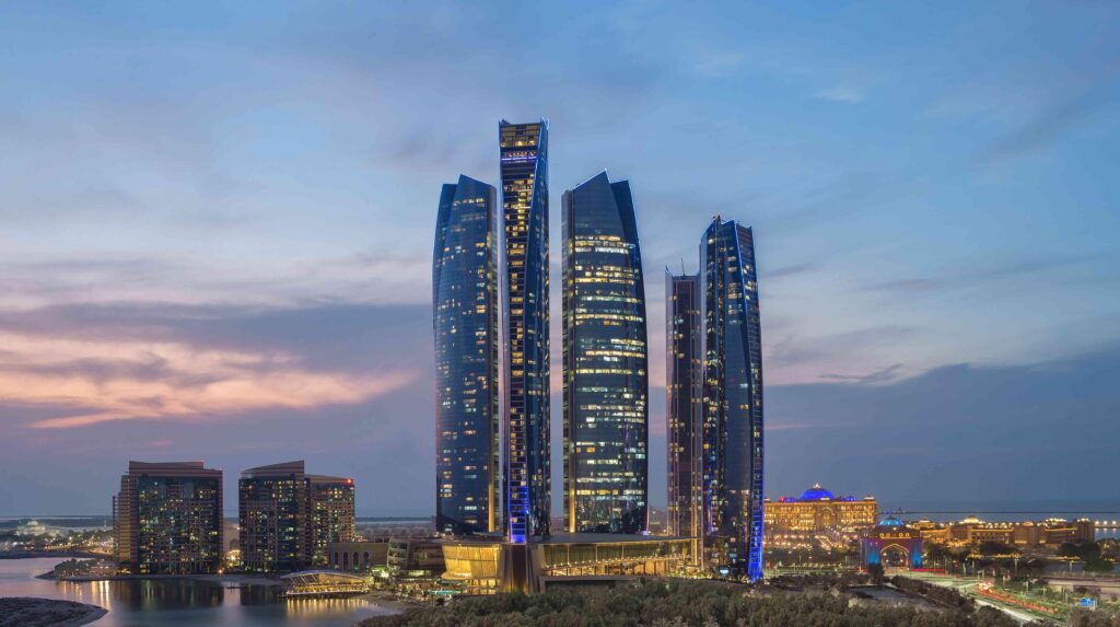 The five Etihad Towers rising above the West Corniche at dusk