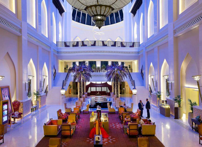 The lobby with its grand staircase and chandelier