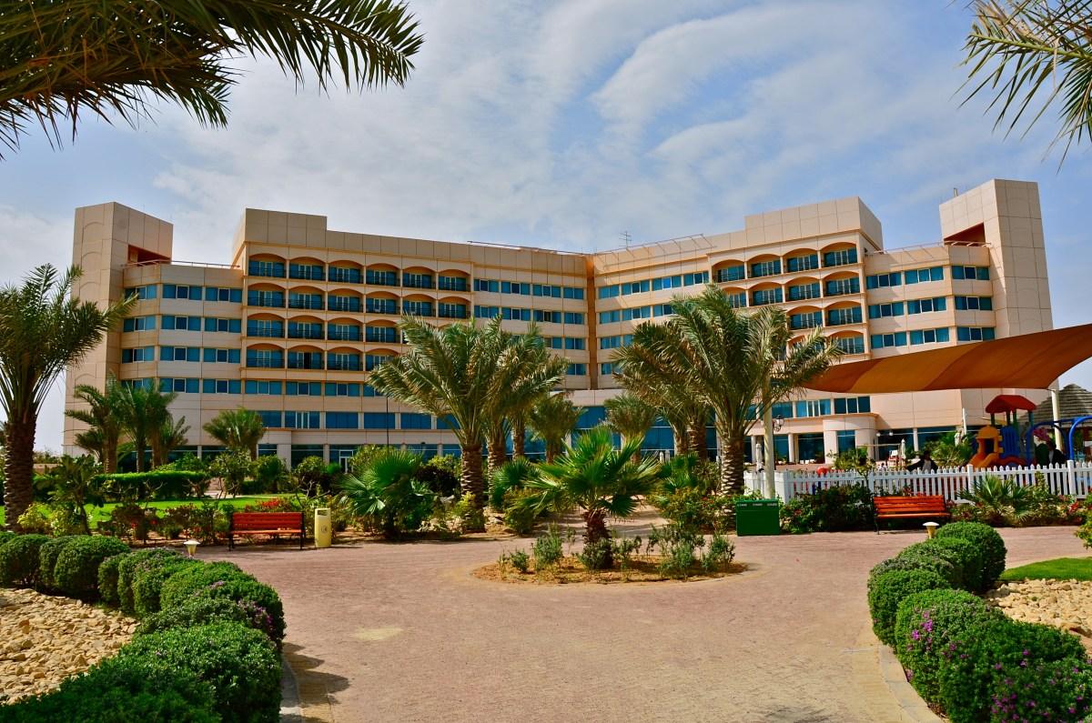 The resort exterior and landscaped grounds at Danat Jebel Dhanna