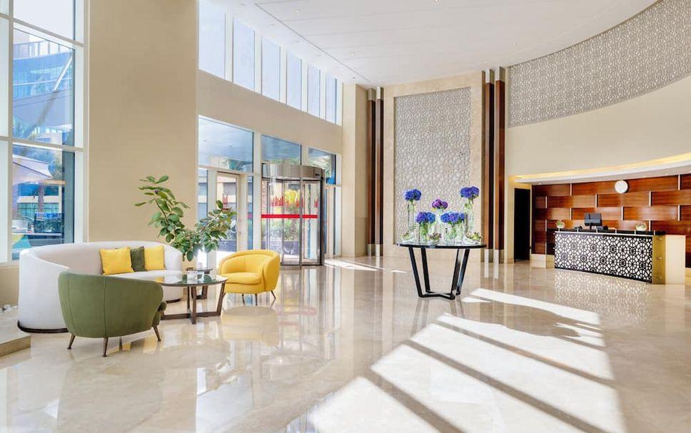 The lobby and arrival area of Grand Millennium Al Wahda