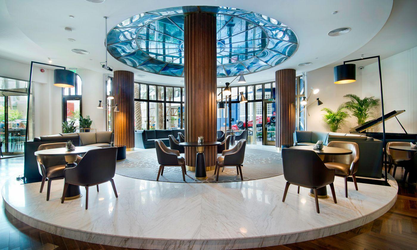 The lobby of Le Meridien Abu Dhabi hung with photographs of state receptions