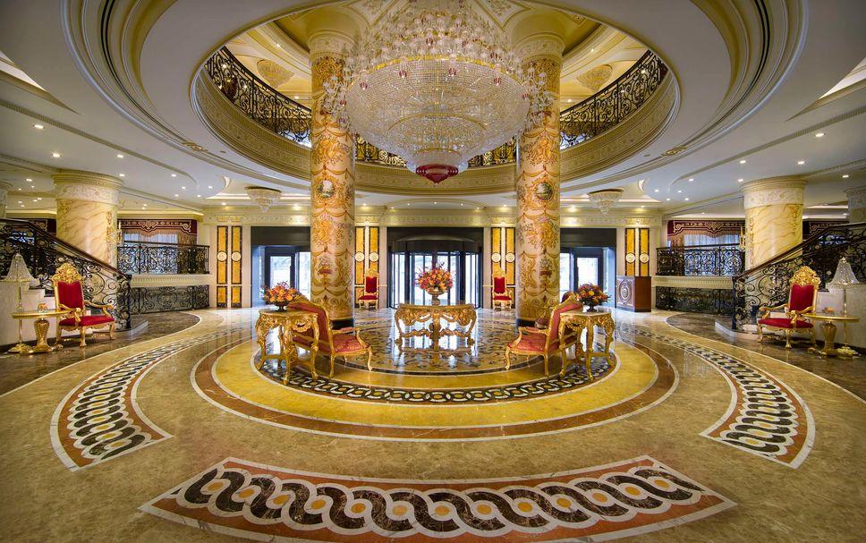 The lobby chandelier and marble finishes at Royal Rose Hotel Abu Dhabi