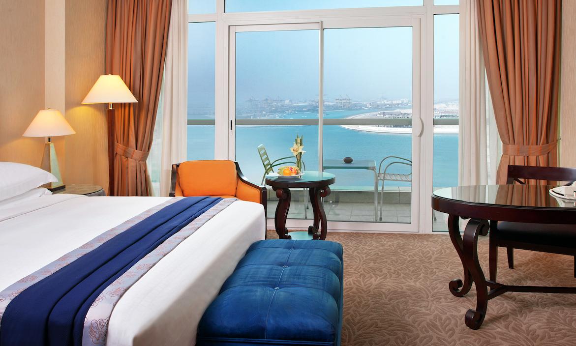 A sea view room at Beach Rotana with its private balcony over the Gulf