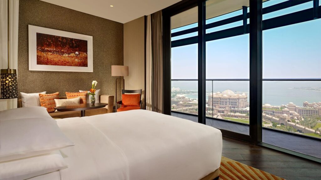 A sea view room with a private balcony above the Corniche