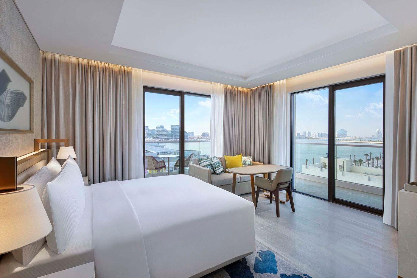 A deluxe bay view room with balcony