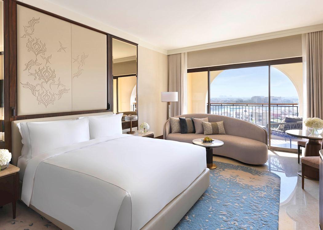 A deluxe room of forty two square metres with a balcony and water view