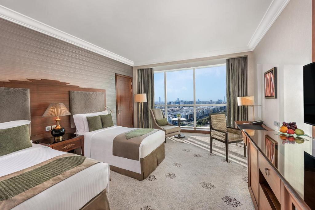 A guest room with French inspired furniture and rich fabrics