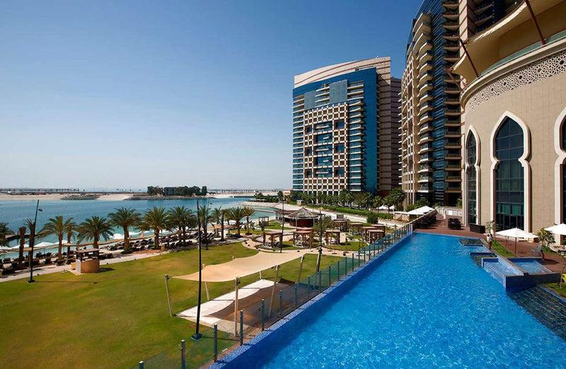 The heated infinity pool set against the Gulf