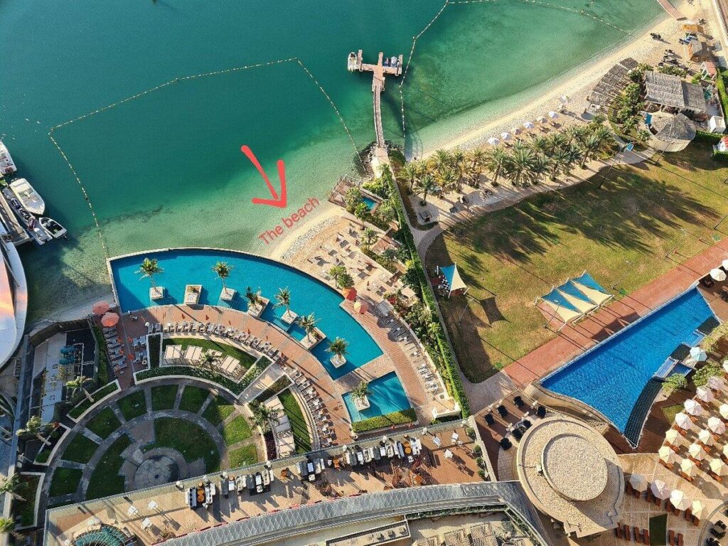The private white sand beach at the foot of the tower