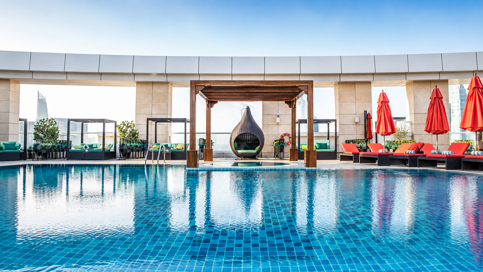 The temperature controlled outdoor pool beneath its pergola