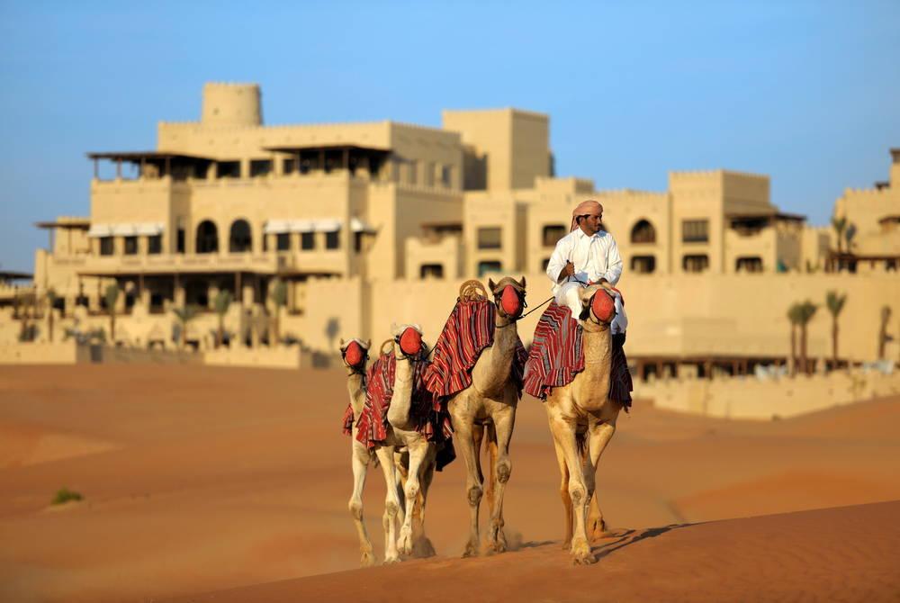 Camel trekking across the dunes with the Desert Excursion Centre