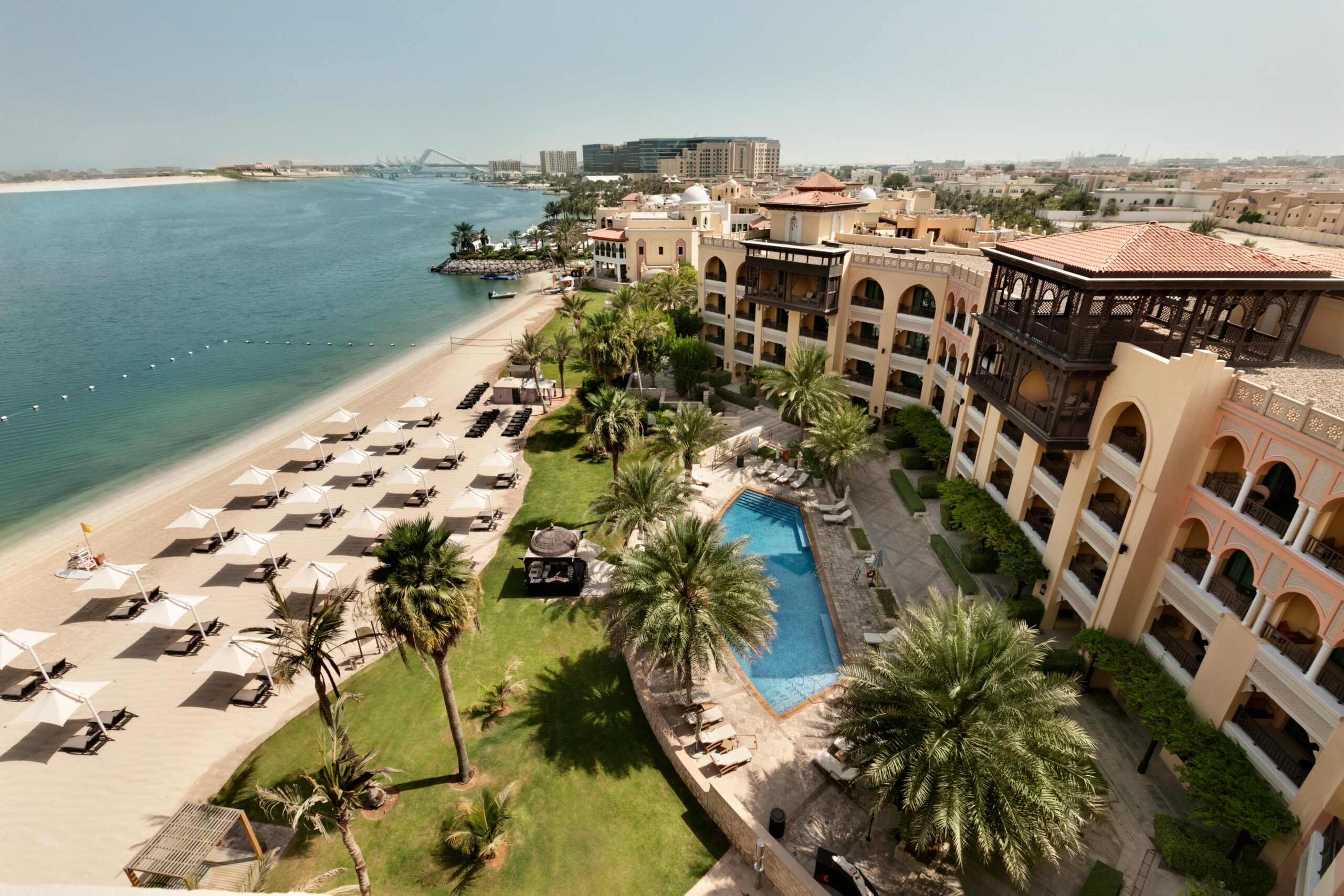 The kilometre of private beach with loungers and umbrellas on the creek