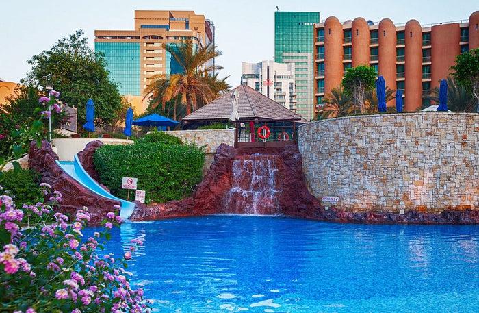 One of the three outdoor pools with the children's pool alongside