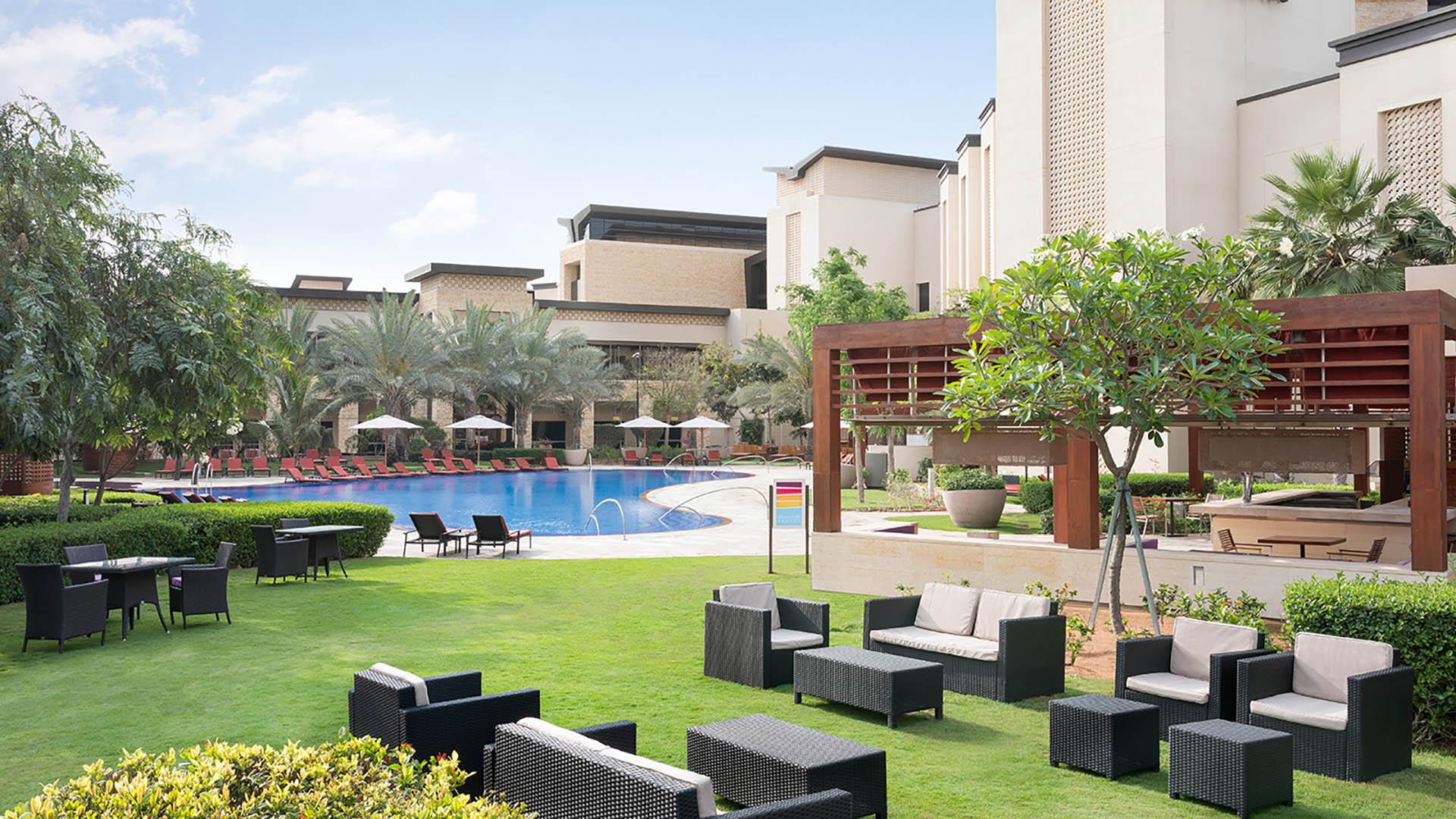One of the two outdoor pools, with cabanas and loungers