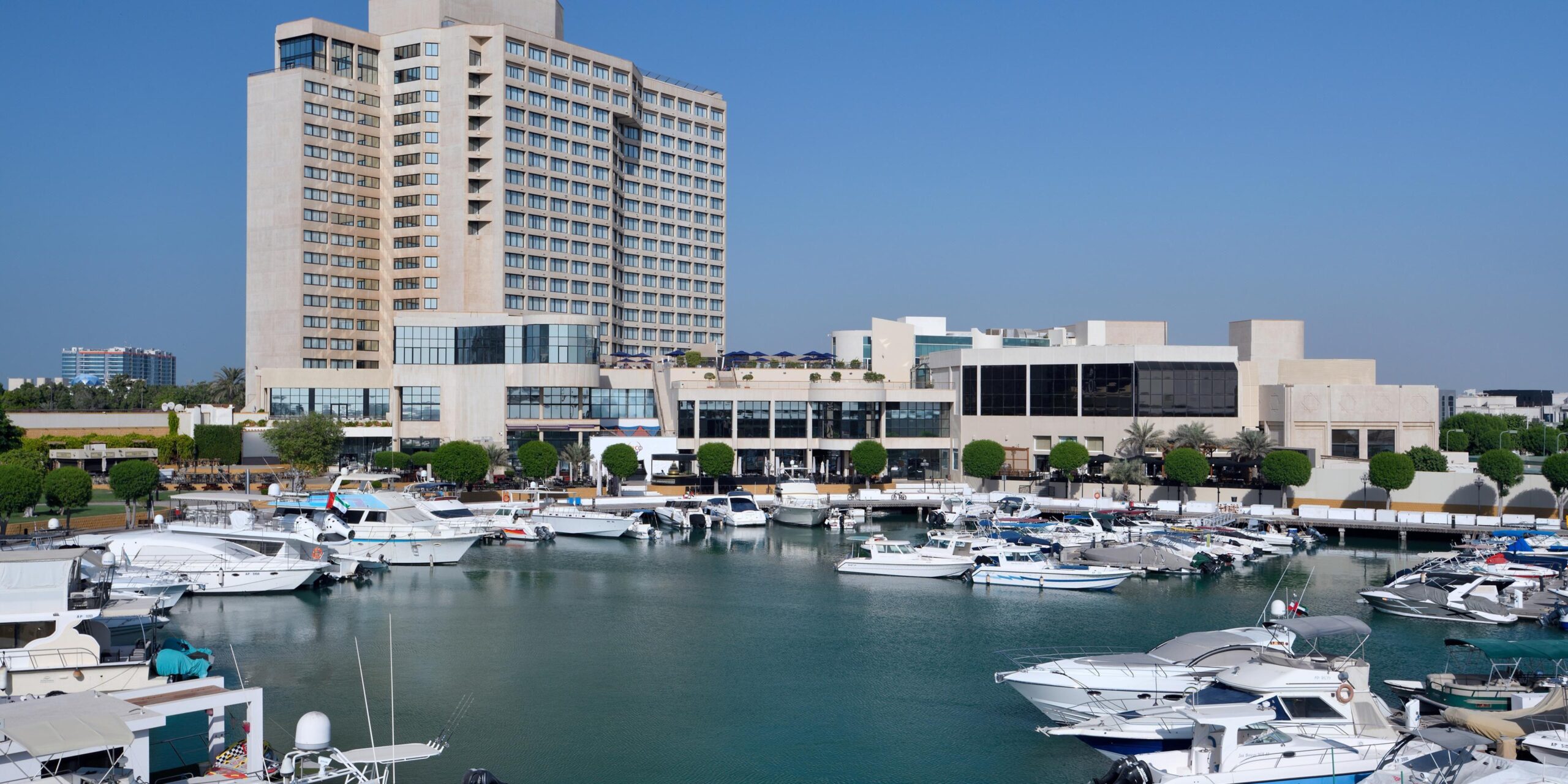 Yachts moored at the hotel's private dock alongside Marina Walk