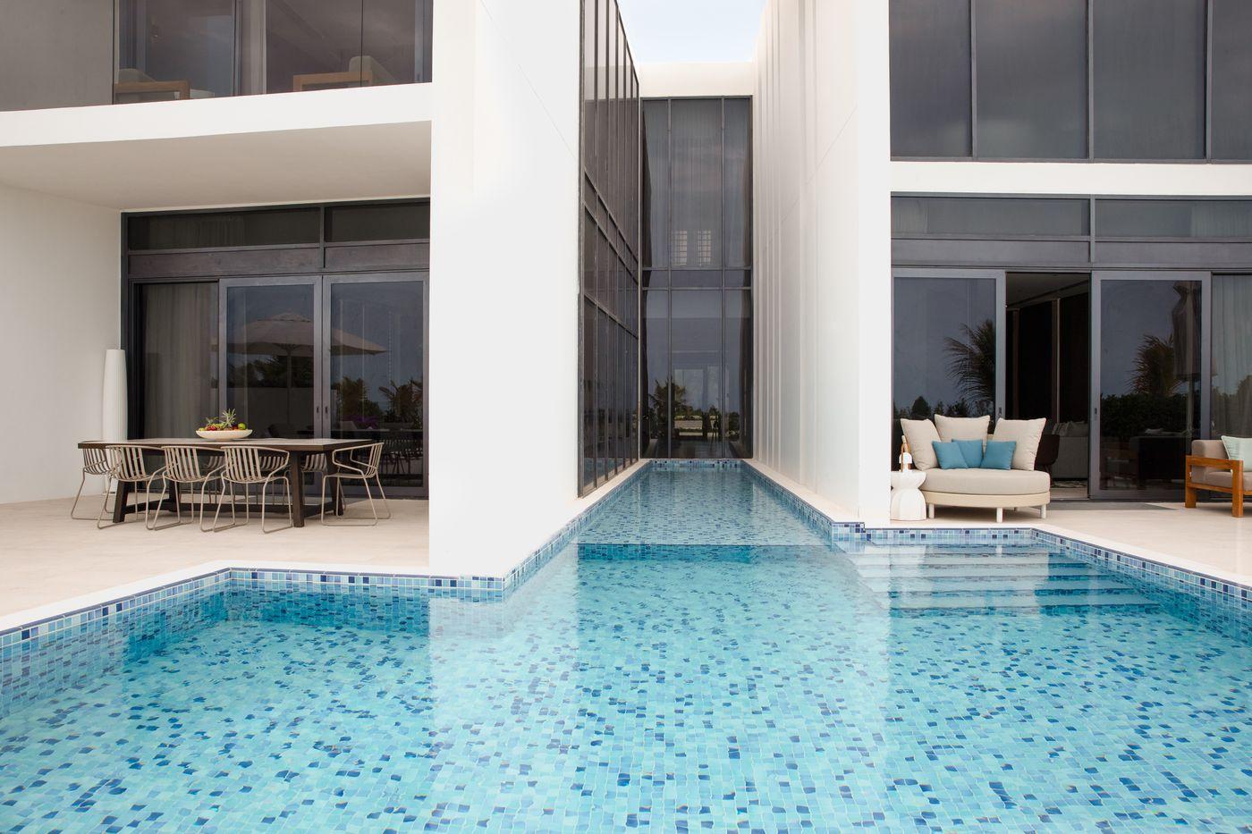A villa with private pool and terrace beside the sand