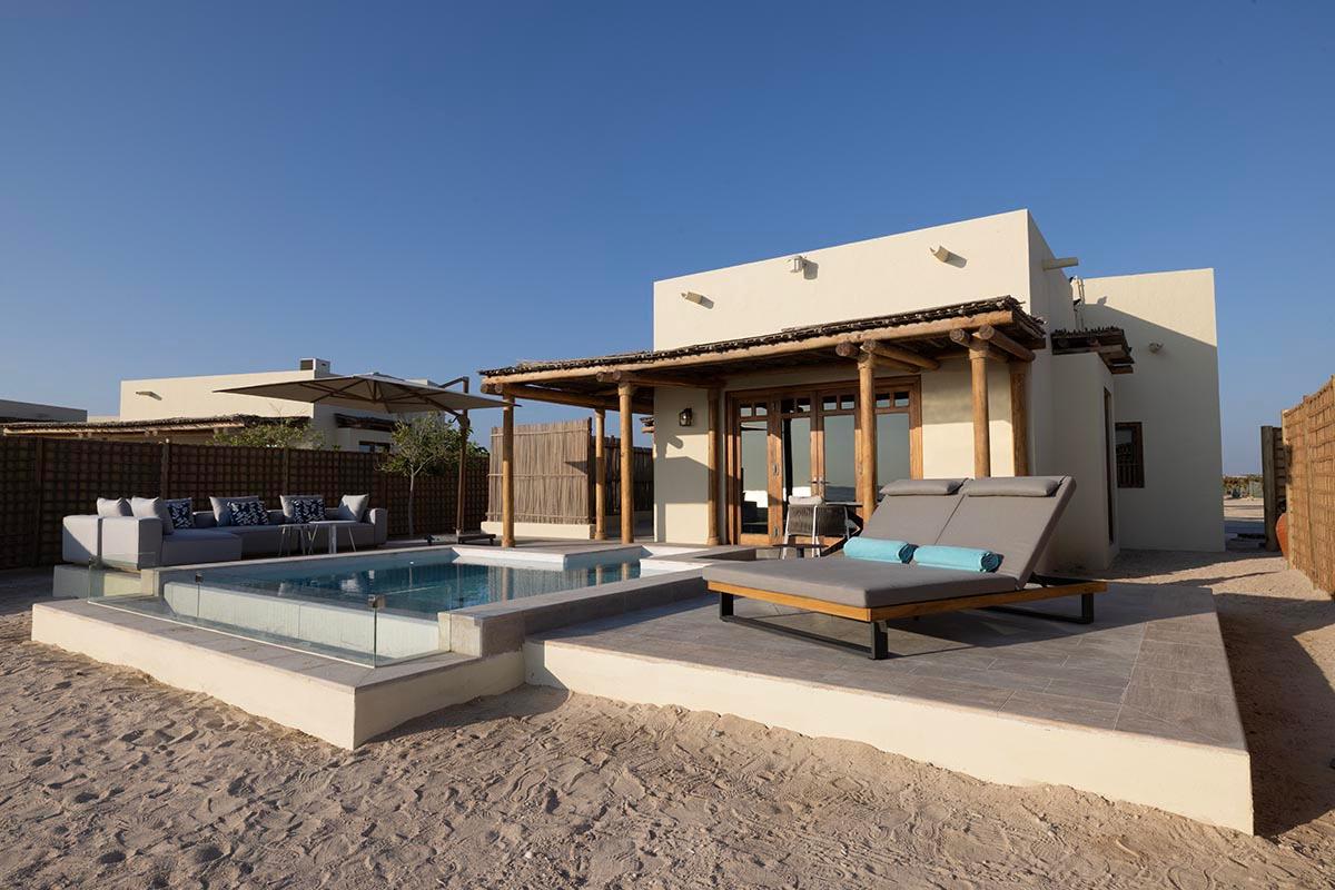 The white sand beach at Al Yamm, with thirty villas spread along its length