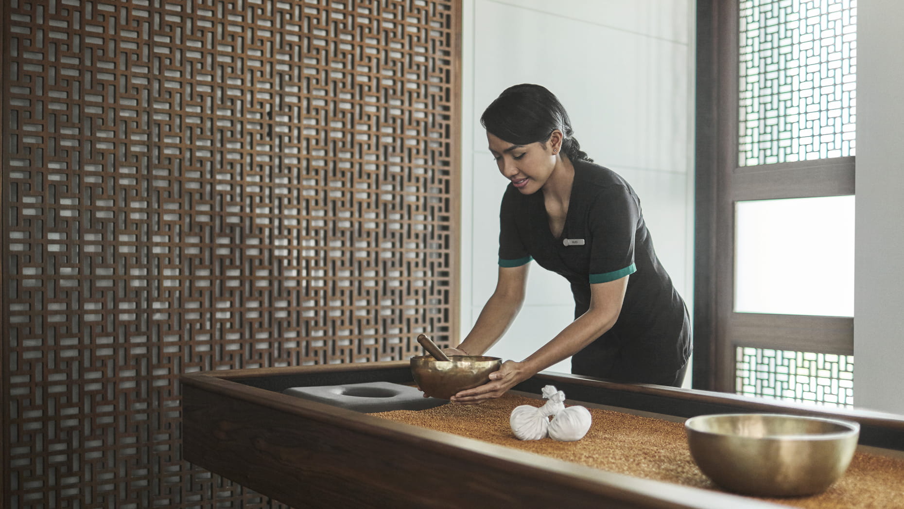 A couples' treatment room at The Pearl Spa with floor to ceiling windows