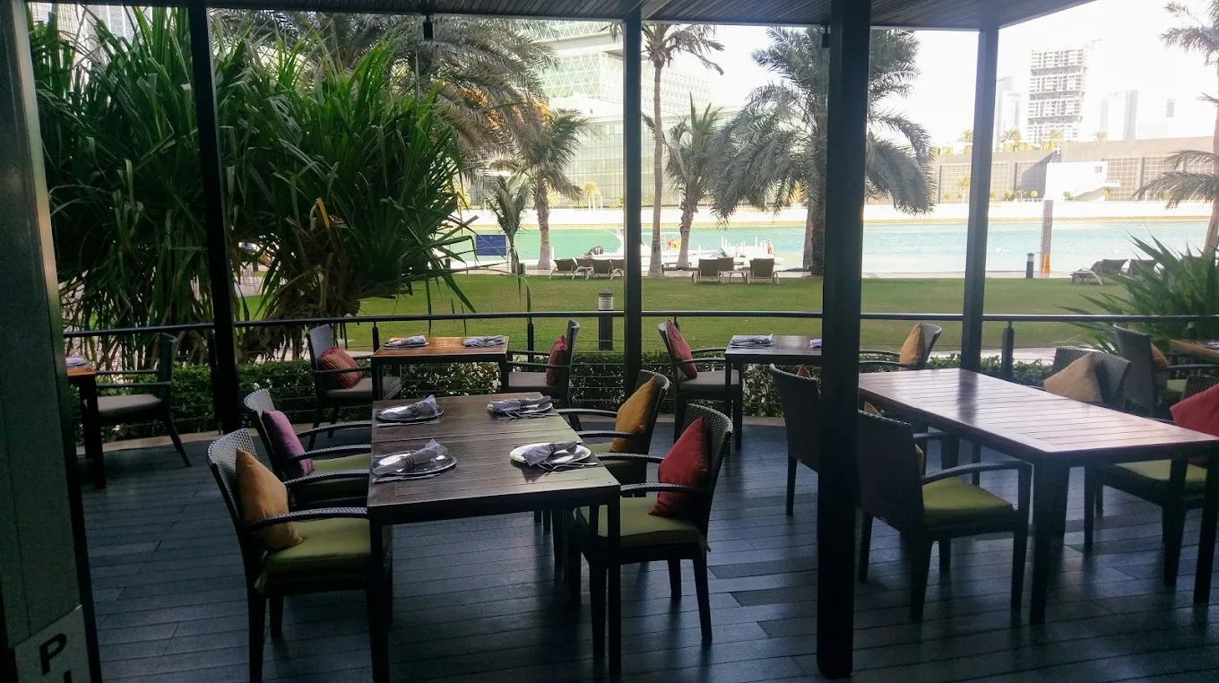 Indigo terrace overlooking Beach Rotana gardens and Abu Dhabi waterfront