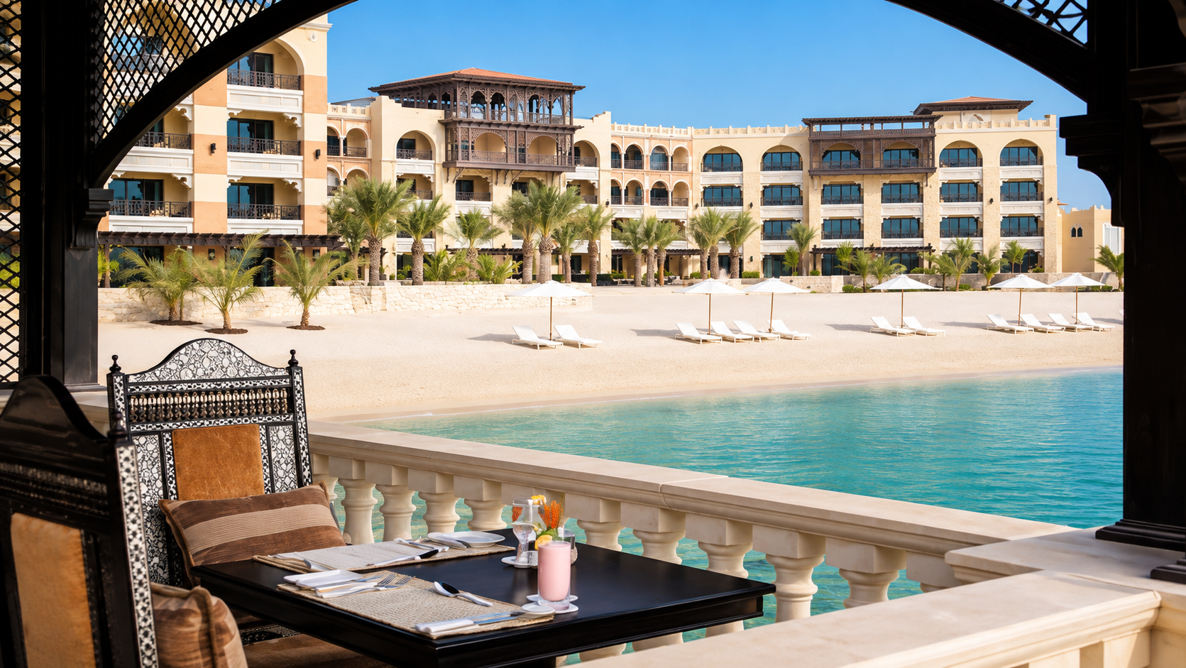 Outdoor beachside dining at Afyä beside the private beach at Traders Hotel