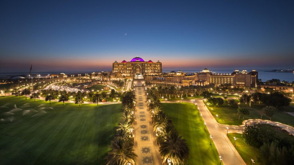 Aerial view across the landscaped gardens, water features and beachfront setting of Emirates Palace Mandarin Oriental.