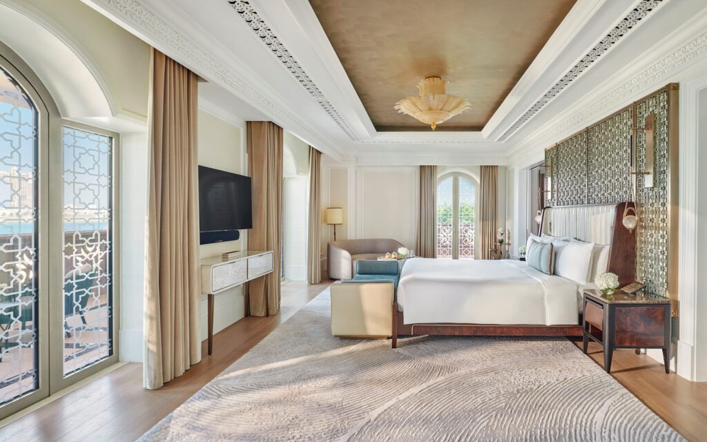 Wide evening view of Emirates Palace Mandarin Oriental and its extensive landscaped grounds on the Abu Dhabi Corniche.