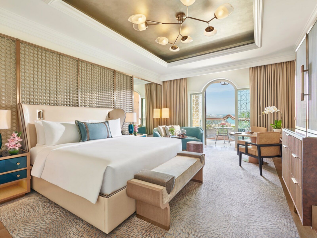 Palace Suite majlis at Emirates Palace Mandarin Oriental with ornate Arabian architectural detailing and chandelier.