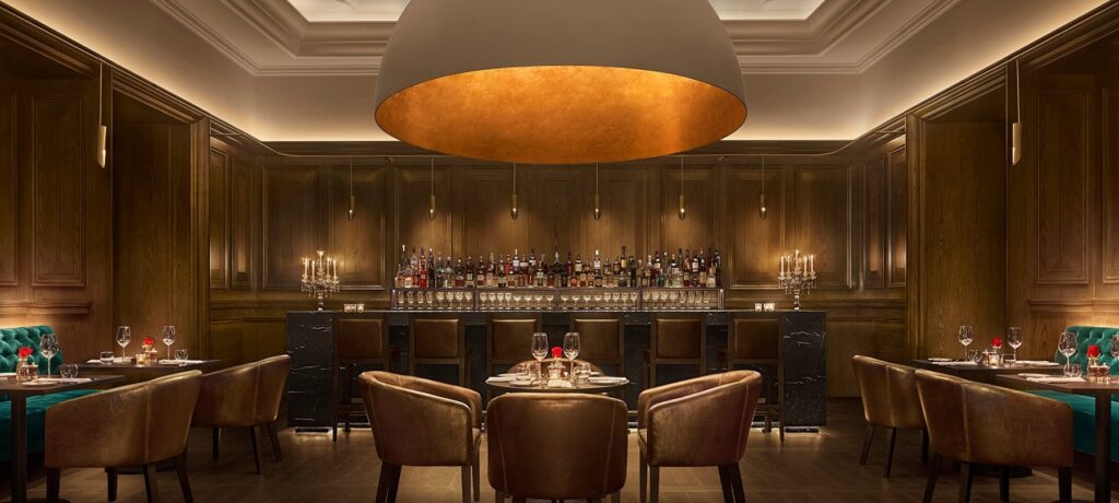 Oak Room wood-panelled British steakhouse interior at The Abu Dhabi EDITION