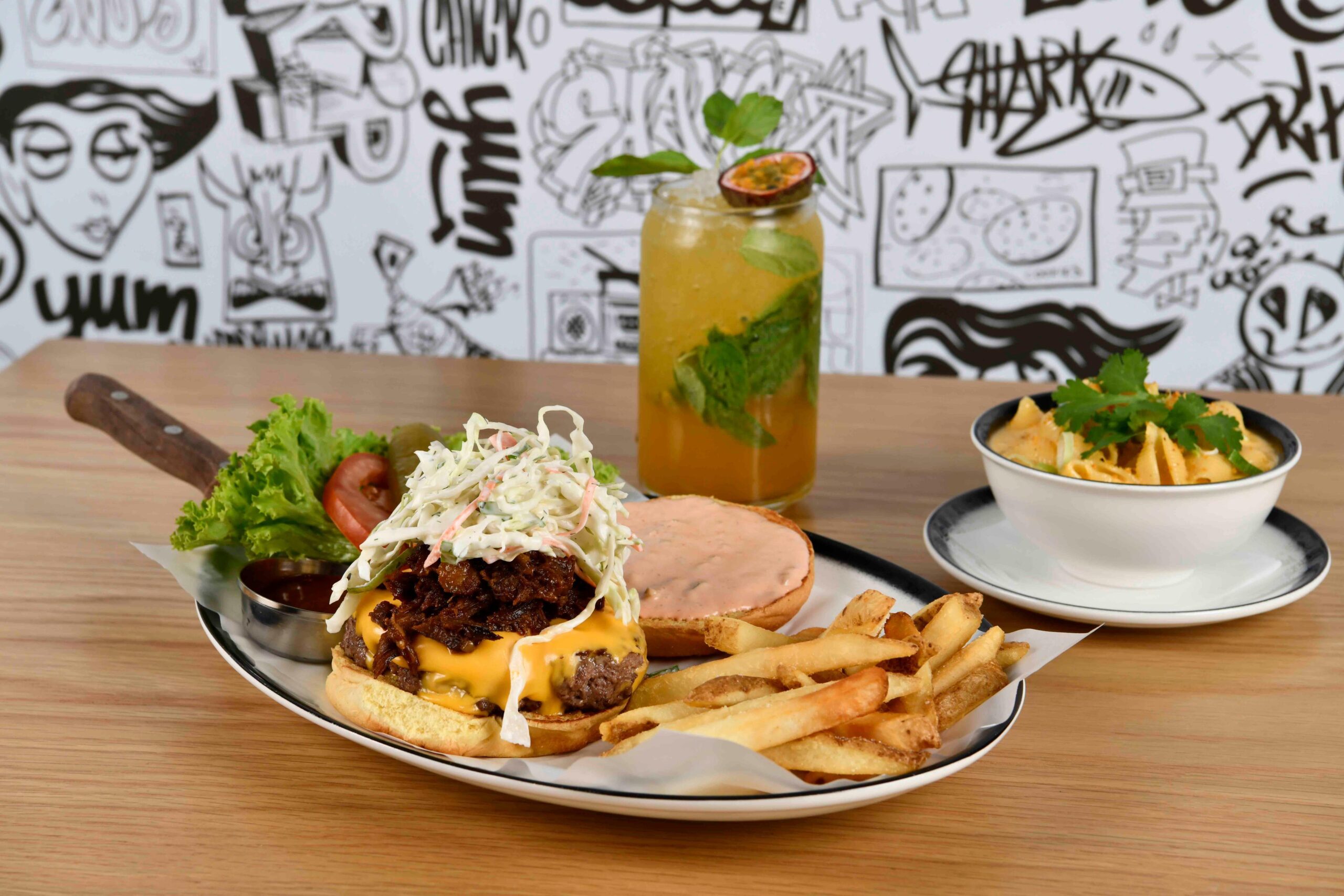 Craft burger and loaded side dishes at Black Tap Mamsha Al Saadiyat
