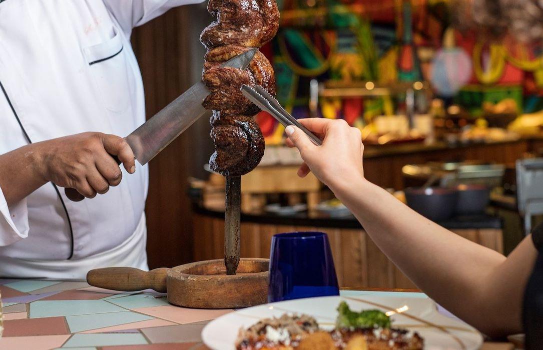 Brazilian rodizio meats served tableside by passadores at Chamas Abu Dhabi