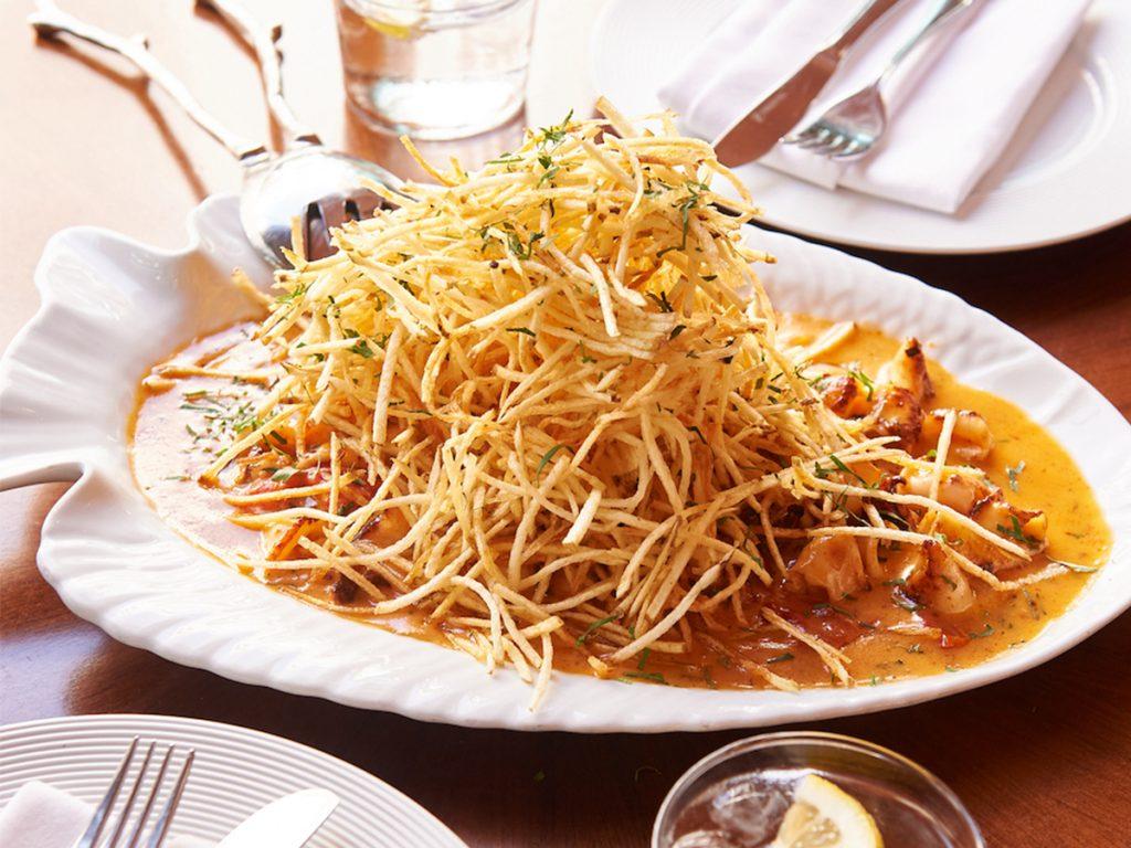 Calamari Mozambique and contemporary dishes at Flamingo Room by tashas Abu Dhabi