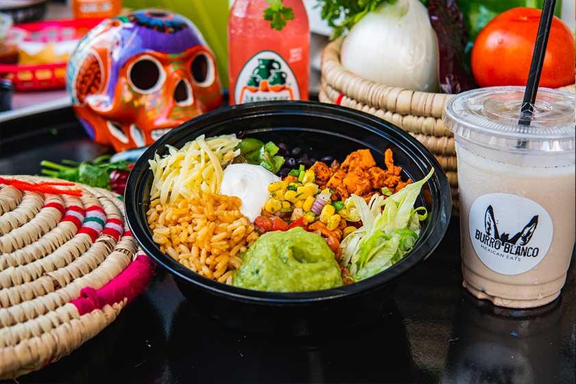 Build-your-own burrito bowl and guacamole at Burro Blanco Saadiyat