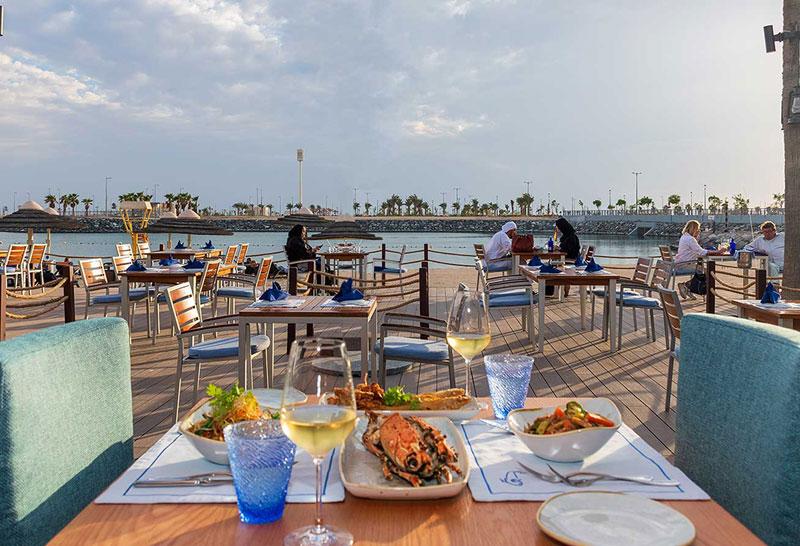 Beachside terrace and Marina Walk setting at Fishmarket InterContinental Abu Dhabi