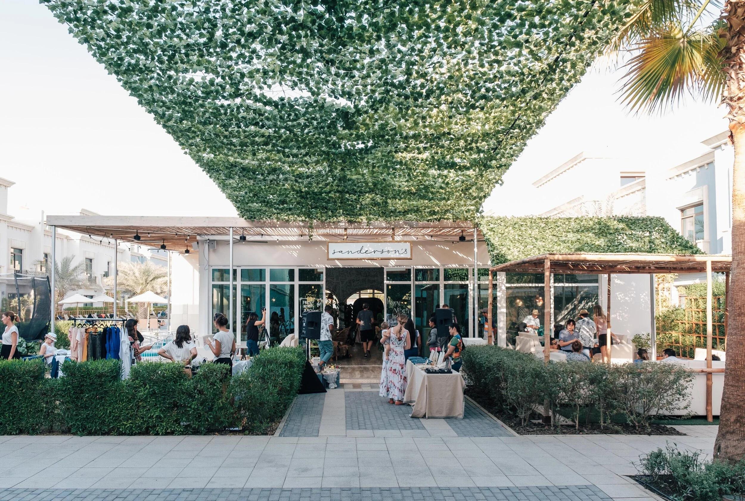 Outdoor garden-style seating at Sanderson's Al Seef Village