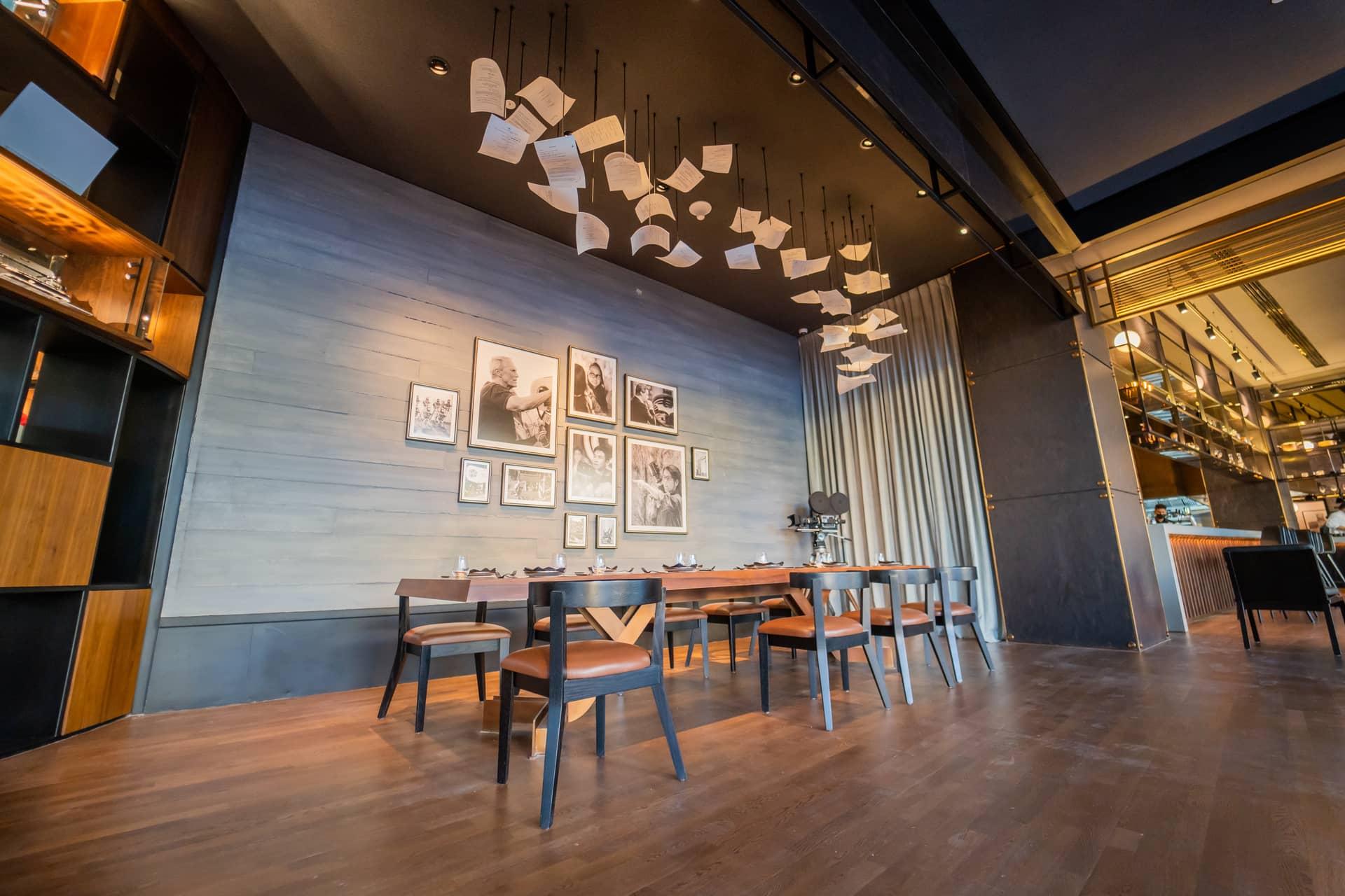 Dinner setting and cinematic details inside The Director's Club Yas Island