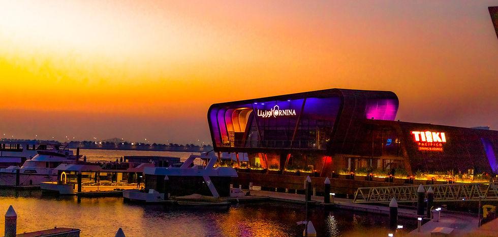 Sunset waterfront seating and live entertainment at Tiki Pacifico Al Raha Beach