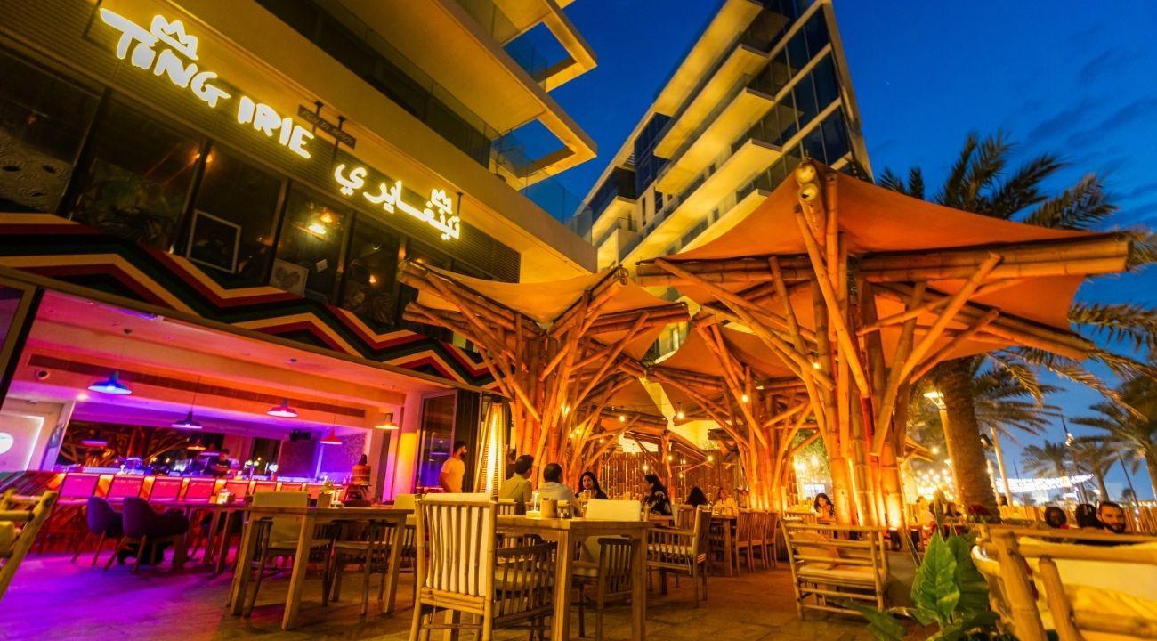 Beachfront terrace and Jamaican dining atmosphere at Ting Irie Saadiyat Island