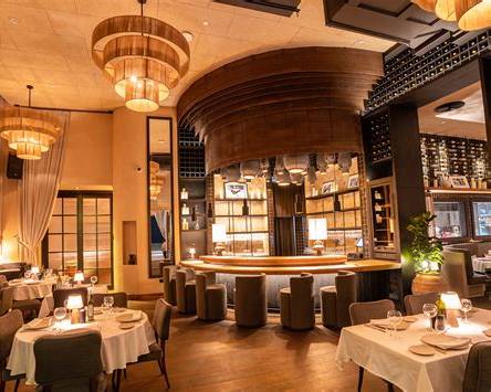 Elegant dinner setting at TOTÓ Abu Dhabi
