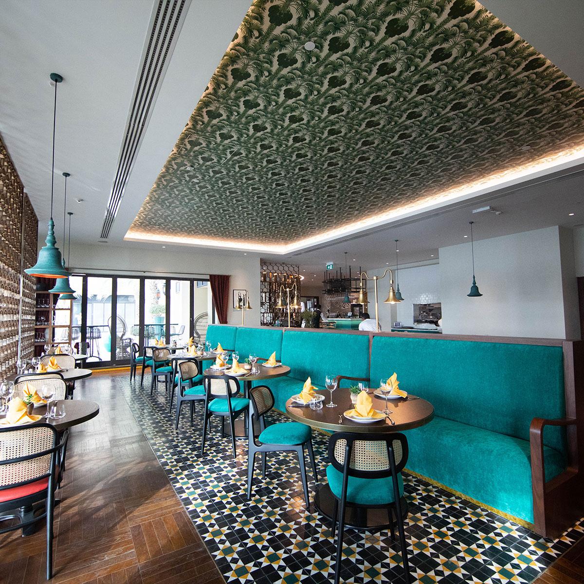 Waterfront dining setting at Ushna Souk Qaryat Al Beri