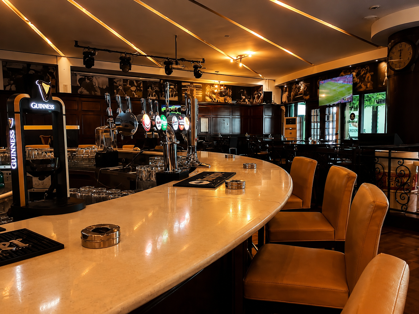 Live sports and evening atmosphere at Victor's Bar & Restaurant Al Rawdah