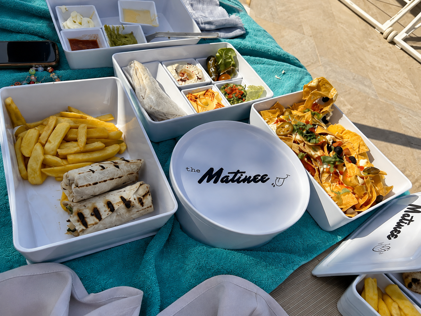 Mediterranean grilled dishes served beside The WB Abu Dhabi family pool