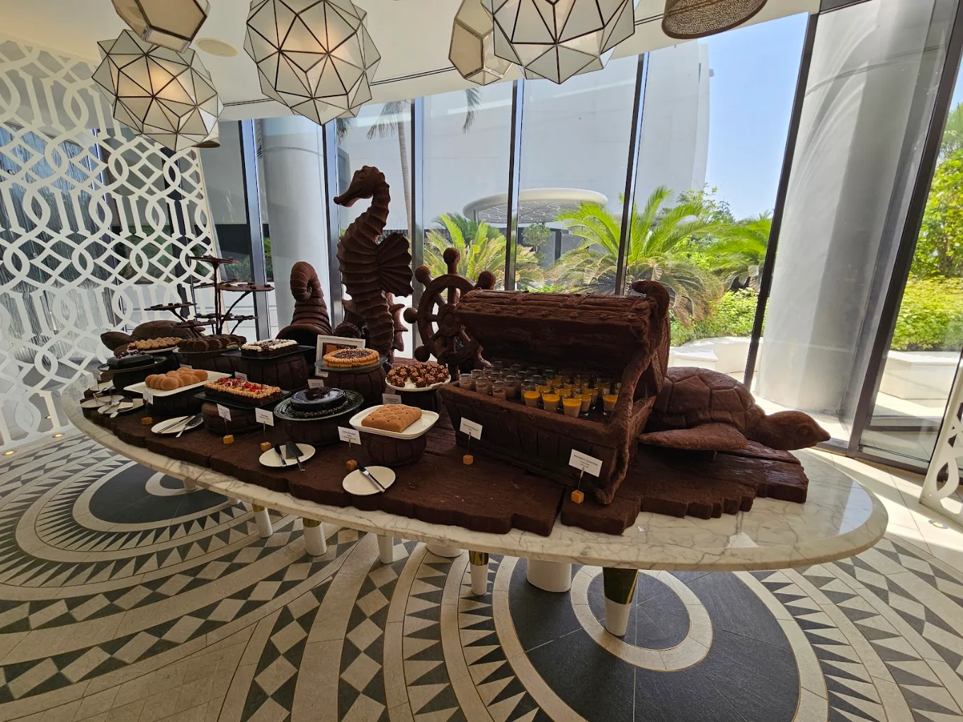 Open-air poolside dining at White Jumeirah Saadiyat Island